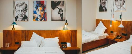 Habitación de hotel con 2 camas y cuadros en la pared en Burundi Palace Boutique Hotel en Buyumbura