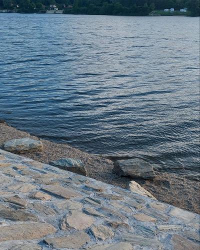 a group of rocks on the shore of a body of water at Vila Ljubomir - Srebrno Jezero in Kisiljevo