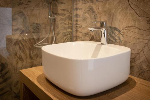 a white sink on a counter in a bathroom at Domaine Baruteau in Soustons
