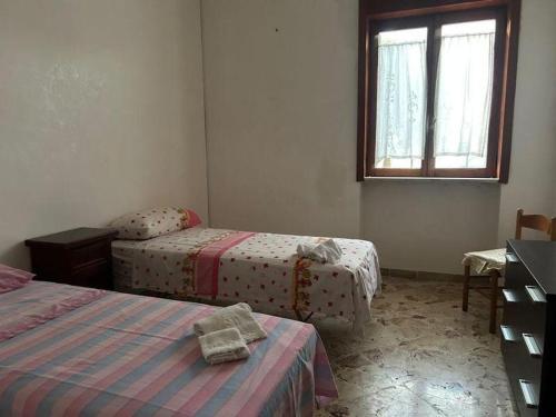 Postel nebo postele na pokoji v ubytování 15 minuti dal mare
