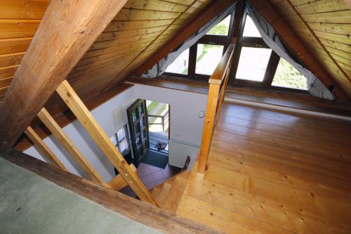 an overhead view of a wooden attic with windows at Penzion Mauritz in Nová Pec