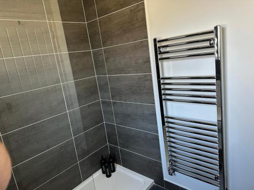 a bathroom with a shower stall and a toilet at 2 hunters lane Donaghadee in Donaghadee