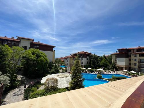 a view from the balcony of a hotel with a swimming pool at Garden of Eden Complex in Sveti Vlas