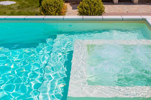 a swimming pool with water in it at Casa Limiuni in Buonfornello