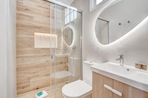 a bathroom with a shower and a toilet and a sink at Good Mood - Sunny Seaview in Callao Salvaje