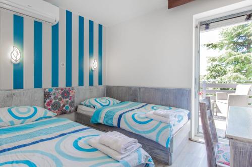 Cama o camas de una habitación en Maestral Residence