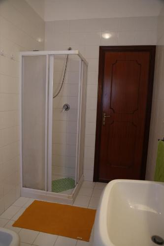 a bathroom with a shower and a tub and a sink at Villa Giù, indipendent villa near airport and sea in Cinisi