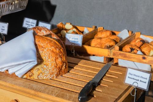 a display of bread and pastries on a table at The Halich Hotel Istanbul Karakoy - Special Category in Istanbul