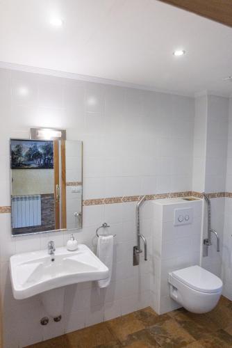 a bathroom with a sink and a toilet at Legaire Etxea in Ibarguren