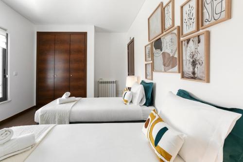 Ένα ή περισσότερα κρεβάτια σε δωμάτιο στο Baleal Deluxe Flat