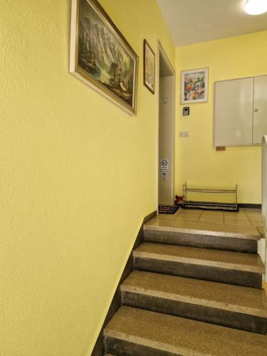 a hallway with stairs in a building at Two-Bedroom Apartment near Triberg Waterfall in Triberg