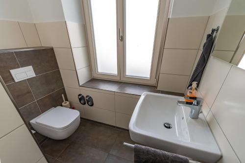 a bathroom with a sink and a toilet at Modern 6 bathroom villa in the city in Oldenburg