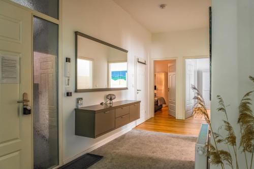 a bathroom with a sink and a mirror at Modern 6 bathroom villa in the city in Oldenburg