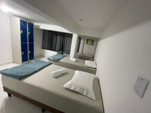 a bedroom with two beds in a room at THE BROTHERS in Angra dos Reis