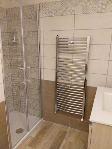 a shower with a glass door in a bathroom at Abruzzo Holiday in Ortona