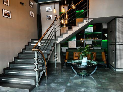 a staircase in a building with a glass table at Aleanda in Chernivtsi
