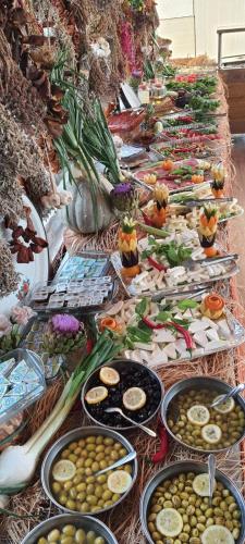 a buffet of different types of food on a table at Grand Yayla Hotel in Cesme
