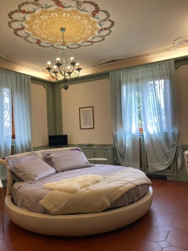 Katil atau katil-katil dalam bilik di Villa Parri Residenza D'epoca
