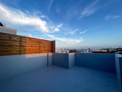 a balcony with a view of the city at 漁聲民宿 FishON B&B in Magong