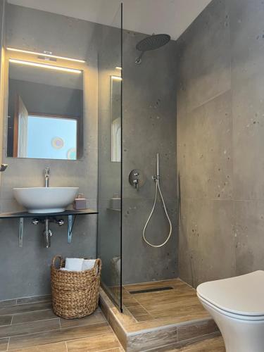 a bathroom with a shower and a sink and a toilet at Australia in Skiathos