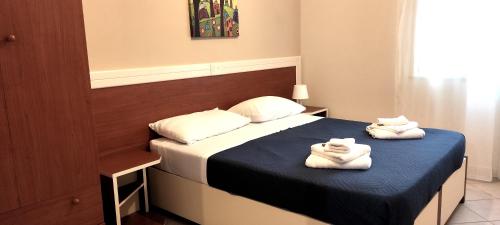 Voodi või voodid majutusasutuse Residence Santa Barbara toas
