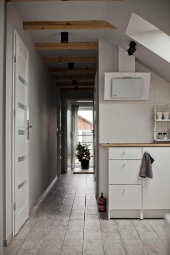 Η κουζίνα ή μικρή κουζίνα στο Spokojna Apartamenty