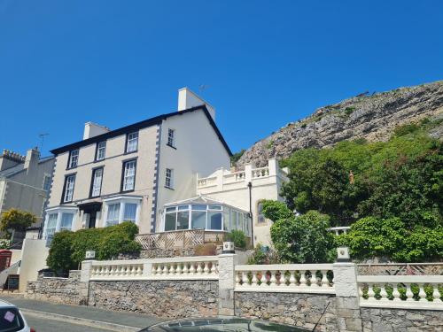 a house on the side of a hill at The Chelsea in Llandudno