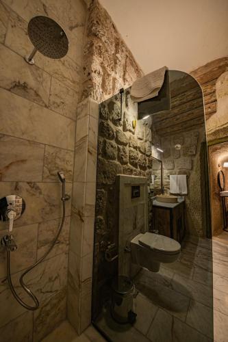 a bathroom with a shower and a toilet and a sink at Janus Cappadocia in Nevsehir
