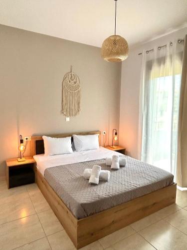 Postel nebo postele na pokoji v ubytování Infinity Suites