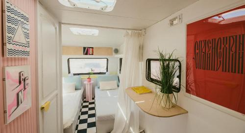 a bathroom with a sink and a toilet in a caravan at Bueno Campers - lux przyczepy na wynajem in Jastarnia