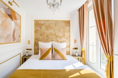 a bedroom with a bed and a large window at Luxury 2 Bedroom Eiffel-Tower with Terrace in Paris