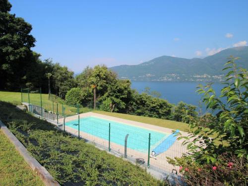 a swimming pool with a view of a lake at Holiday Home Antonia by Interhome in Porto Valtravaglia