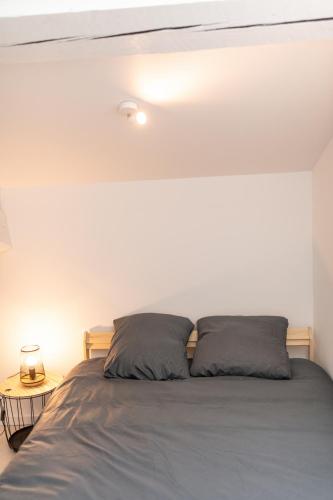 Ένα ή περισσότερα κρεβάτια σε δωμάτιο στο KASA DUPLEX - Climatisation - Balcon - Parking Privé