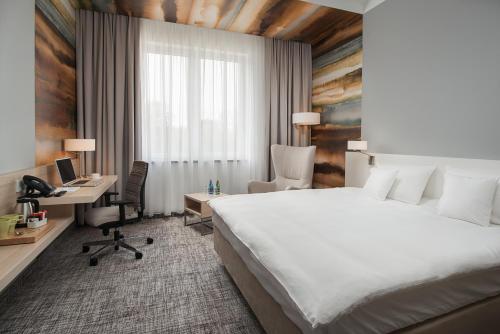 Posteľ alebo postele v izbe v ubytovaní Park Hotel & Restauracja Browar Brzeg