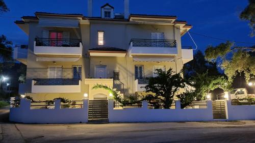 a large white house at night at Sun Ray Sivota 2 in Sivota