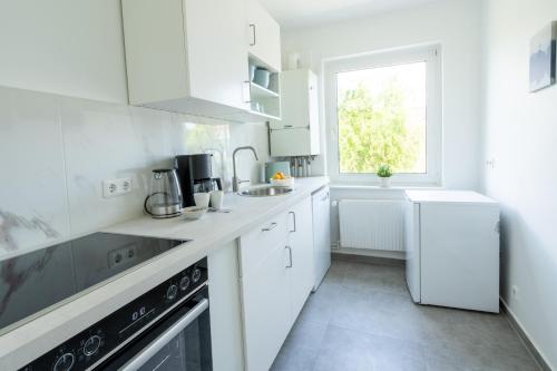Kuchyň nebo kuchyňský kout v ubytování 2 Zimmer Ferienwohnung Am Hafen