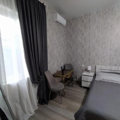 Postel nebo postele na pokoji v ubytování Guest House Mtisubani