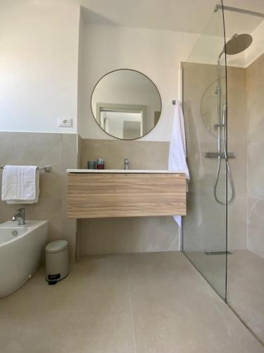 a bathroom with a sink and a mirror at Residenza Viel in Bibione
