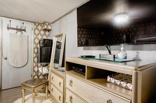 a kitchen with a counter and a chair in a room at Nice Cozy Room By Empire City Casino And Cross County Mall in Yonkers