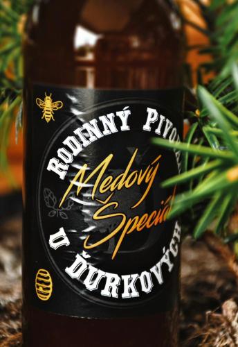 a bottle of honey with a sign on it at Relaxcentrum Ľudmila in Cabaj-Čápor