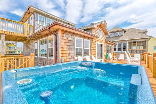 a house with a swimming pool in front of a house at Simplify #1F in Frisco