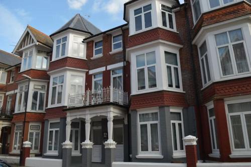 a row of houses on a city street at Pier12 in Eastbourne