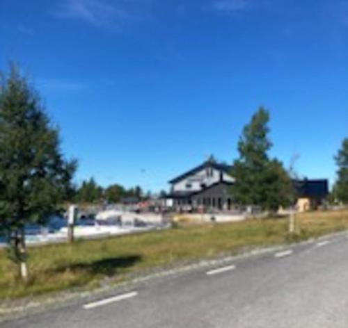 a house on the side of a road at Boat house with direct connection to the sea in Umeå