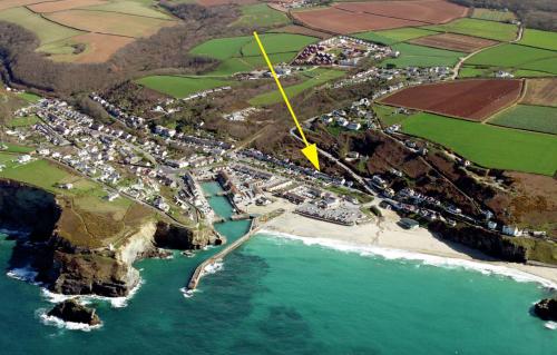 an aerial view of a town next to a beach at Newly renovated cottage with hot tub in Portreath