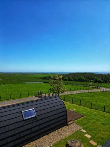 a roof of a house with a view of a field at Willow Cabin in Hexham