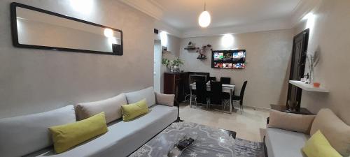 a living room with a couch and a table at Casa Home in Casablanca