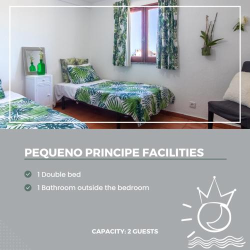a picture of a bedroom with two beds and a window at Villa Principezinho in Portimão