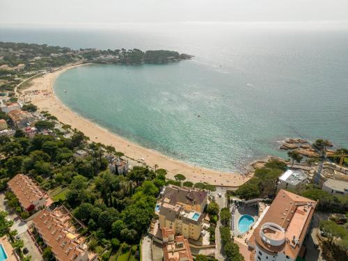 an aerial view of a beach and the ocean at Ilunion Caleta Park in Sant Feliu de Guixols