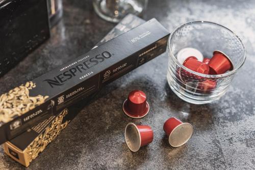 a glass of red and white candy next to a book at Apart Dengg in Mayrhofen