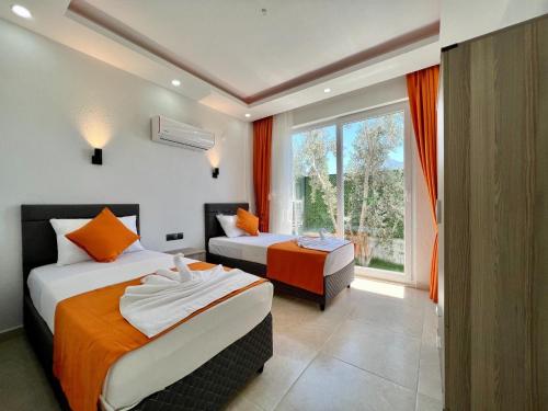 Postel nebo postele na pokoji v ubytování Fethiye Villa İzci